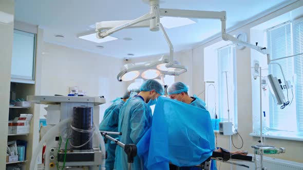 Professional surgeons and assistant in surgery room