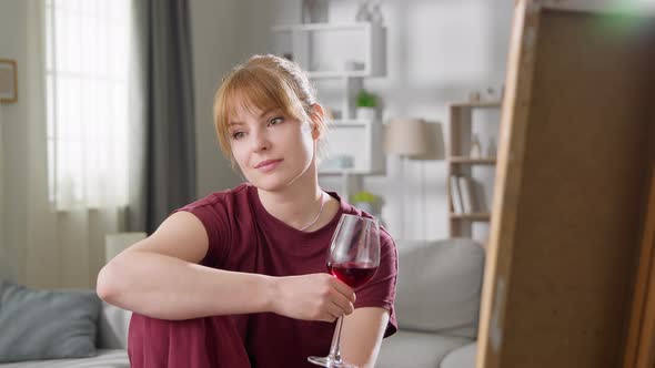 Portrait of a Young Woman with a Glass of Red Wine