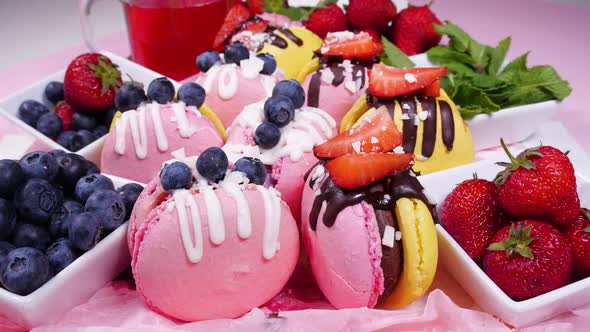 Handmade Beautiful Macaroon Sweet Food Dessert with Fresh Strawberries and Blueberries Decorated