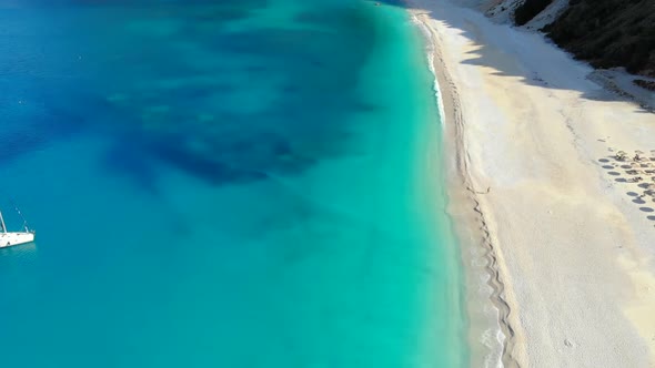 Aerial View of Beautiful Turquoise Crystal Clear Water and Resort Coastline White Sand and Rocks on