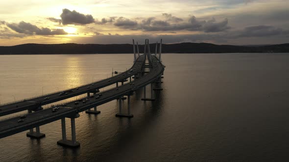 An aerial shot over the Mario M. Cuomo Bridge from the north side. The drone dolly in up the middle