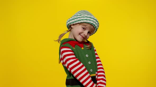 Shy Shamed Child Girl Christmas Elf Santa Helper Costume Posing Looking Camera Feels Guilty