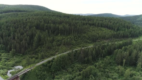 Top View of Beautiful Green Landscape with Truck Driving Along Highway