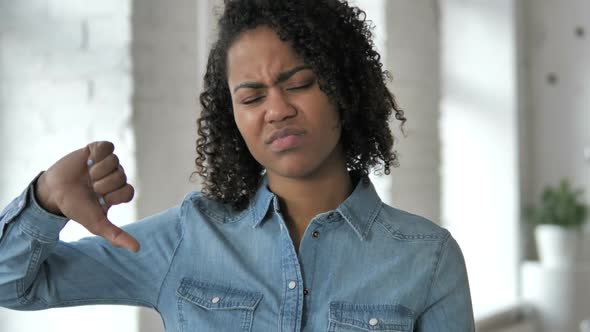 Thumbs Down By Upset Young African Girl