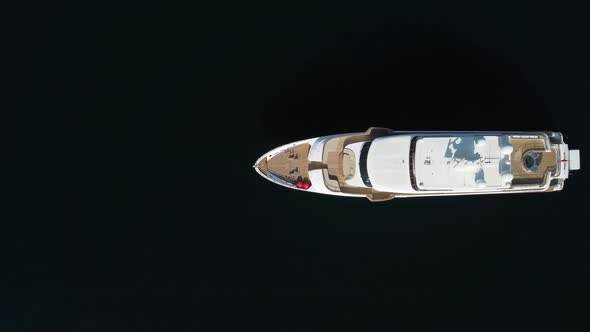 Aerial Top Down View of Catching Luxury Motor Boat Racing on the Water Large Luxury Yacht Floats in