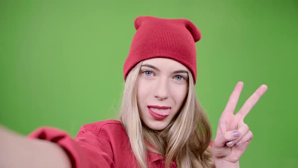 Teenager Makes Selfie with Different Emotions. Green Screen. Close Up. Slow Motion