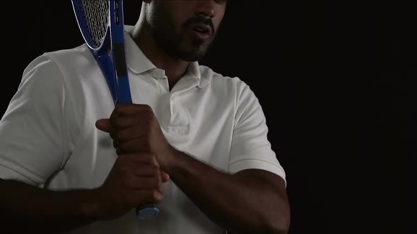 Handsome Tennis Player in White Sportswear Ready for Receiving the Ball, Match