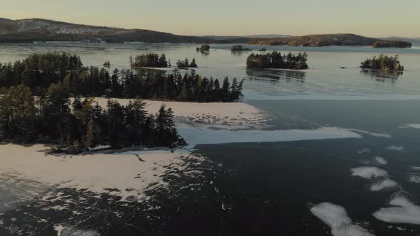 Aerial shot of Moosehead Lake covered with ice. Maine. USA.