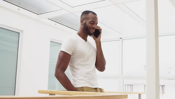 Young adult mixed race man enjoying time at home