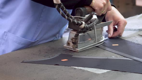 Close Up of Professional Ironing at Garment Fabric