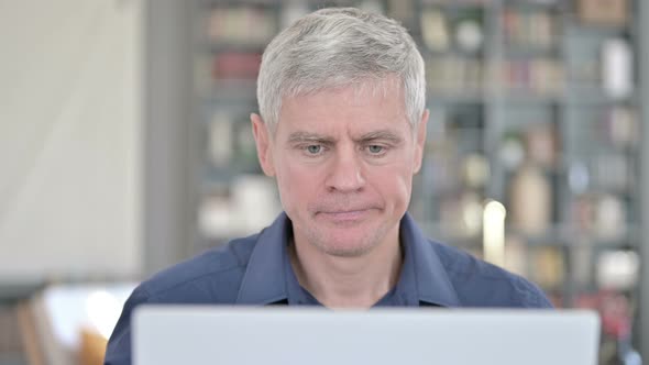 Portrait of Middle Aged Man Standing Up and Going Away