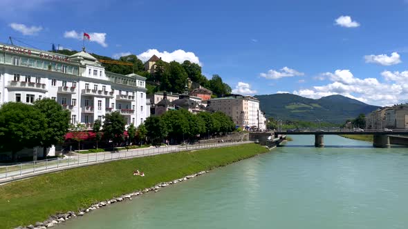 Panning shot of beautiful cityscape with Salzach river and castle in Salzburg,4k