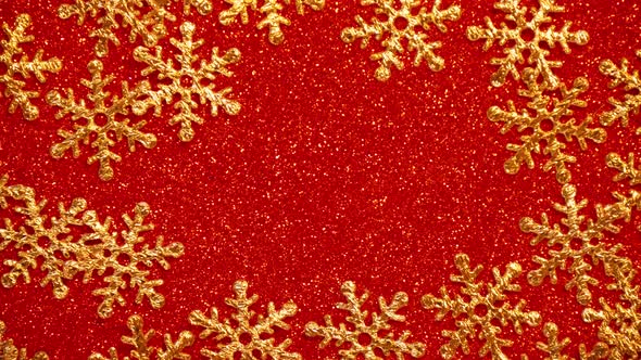 Christmas Ornament Frame with Golden Snow Flakes on Red Glitter Background