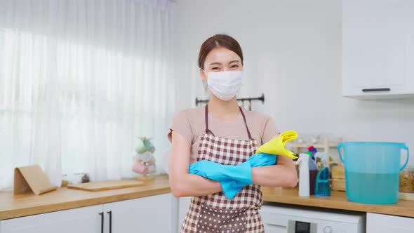 Portrait of Asian young cleaning service woman worker and smile look at camera after doing housework