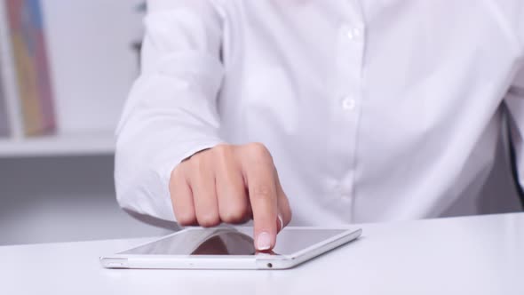 Woman Using Tablet for on Line Purchase with Credit Card