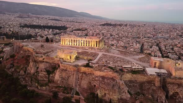 The Beautiful Acropolis Parthenon on Rocky Outcrop Above Athens City, Aerial during Sunrise.