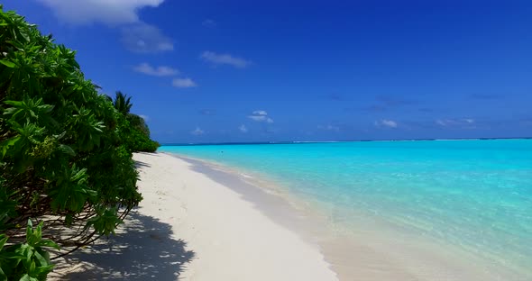 Natural aerial island view of a white sand paradise beach and aqua turquoise water background in vib