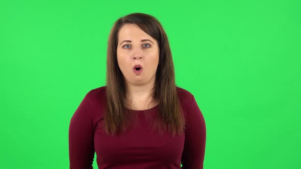 Portrait of Pretty Girl Listening Information Then Shocked and Very Upset. Green Screen