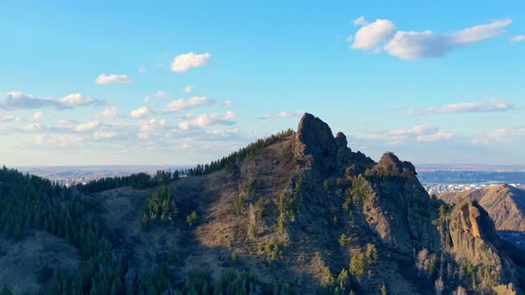 Aerial Panorama of the Rock on the Background of the City