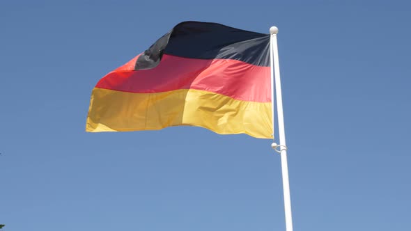 Famous  German flag in slow motion on flag-pole floating on wind 1080p HD footage -   Germany nation