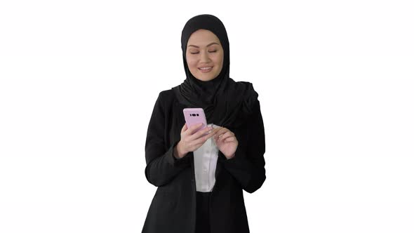 Smiling Arab Woman Using Smart Phone on White Background