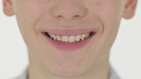 Close Up of Smiling Lips of Young Man