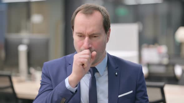 Portrait of Sick Businessman Coughing