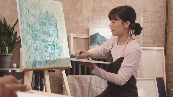 Asian Woman Teaching Art