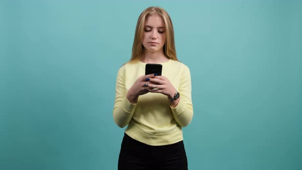 Young Concentrated Woman Using Smartphone, Serious Surprised Girl Texting on Her Phone