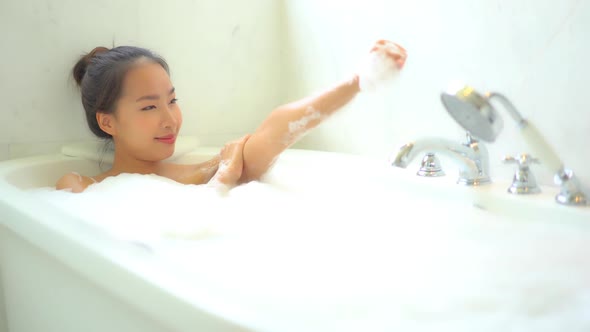 Young asian woman relax in bathtub