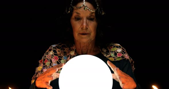 Clairvoyant looking in her crystal ball