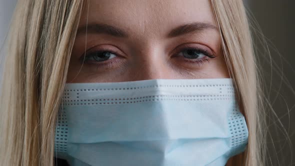 Extreme Closeup Female Face Caucasian Woman Wearing Medical Mask Blue Eyes Blinking Girl Protecting