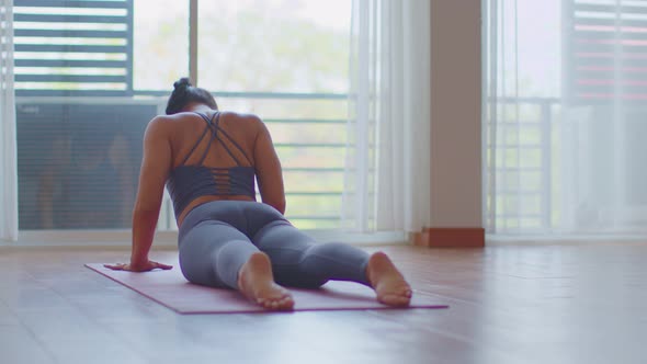 Back of views Calm of Athletic Healthy Asian woman in sportswear workout yoga cobra pose excercise