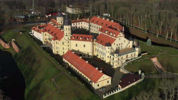 Flying Over the Nesvizh Castle the Park Around the Castle and the Lake Aerial Video of Nesvizh