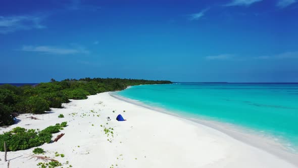 Aerial above landscape of luxury seashore beach break by blue lagoon and white sand background of a 