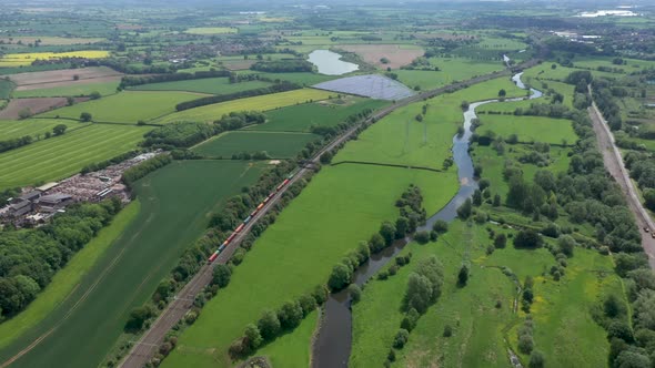 Railway in the countryside and trains passing, aerial view