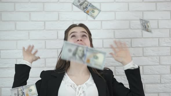 Business woman rejoices at money. 