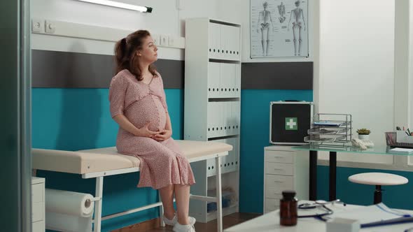 Portrait of Woman Expecting Child at Medical Appointment