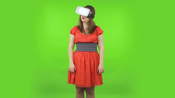 Cute Girl with Virtual Reality Headset or 3d Glasses. Green Screen