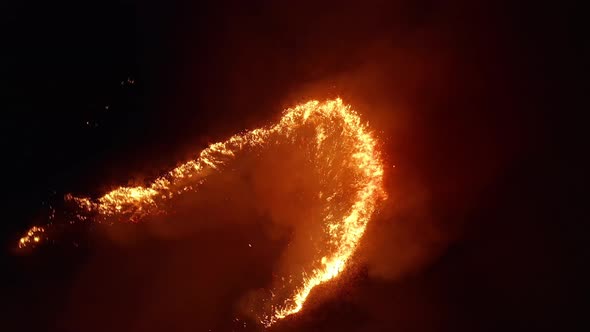 Aerial View. Dangerous Fire in the Field. Night Fire, Natural Disaster.