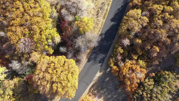 Looking down at road from aerial view slowly moving towards the ground