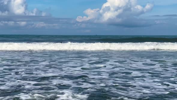 Athletic Man Swimming in the Raging Indian Ocean Off the Coast of Bali in Indonesia Large Surfing