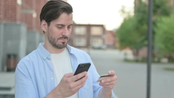 Man Having Online Payment Success on Smartphone