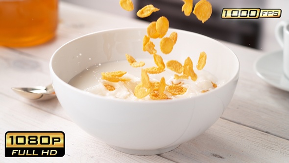 Cornflake Cereals Falling into Bowl with Milk