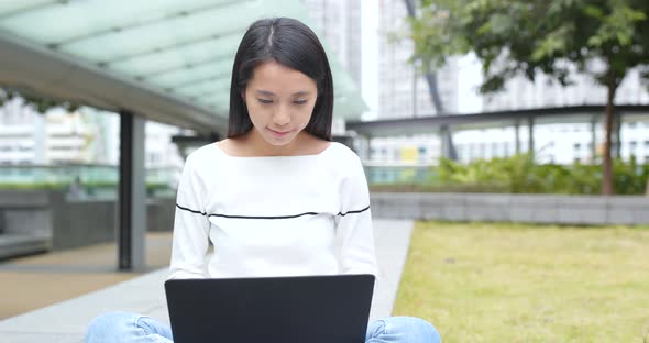 Woman use of laptop computer at outdoor