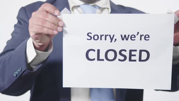 Businessman Posts Sign On Window Sorry Were Closed 2
