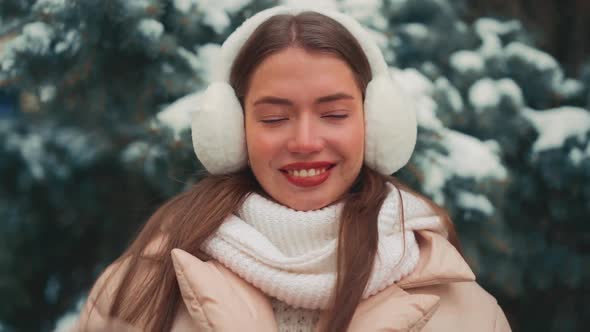 Close Up Portrait Young Woman with Fur Earmuffs Winter Day Outdoor