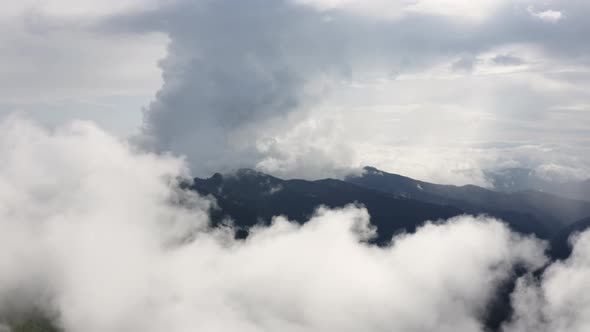 Flyover Cloudscape above Mountains. Flying through the Cloud. Fly in Organic clouds. 