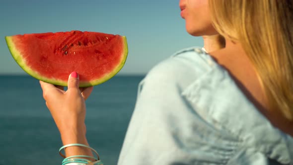 Woman Holding a Piece of Watermelon