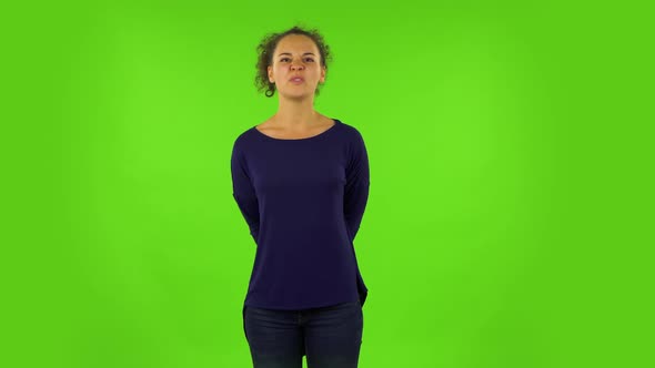 Curly Woman Looking Forward and Resented By What She Saw. Green Screen